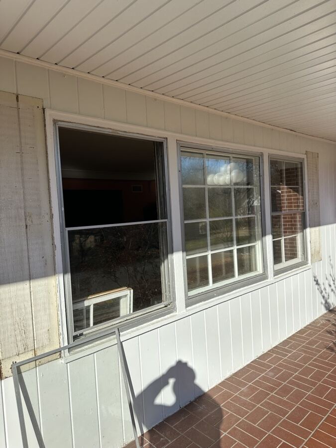 Porch wall with an old window opening removed before replacement