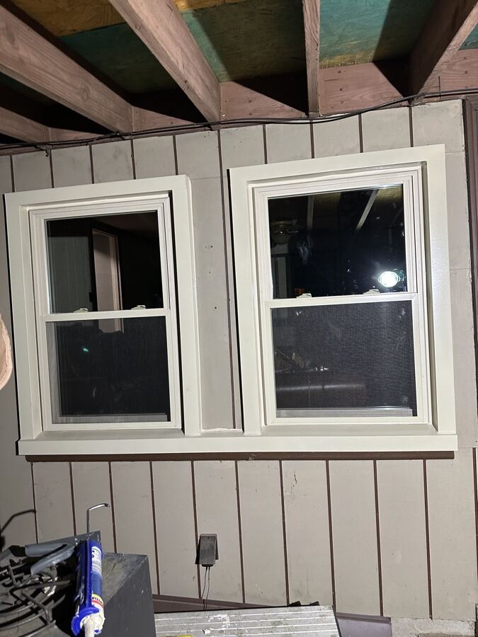 New windows set in the same addition, still under construction, after replacement