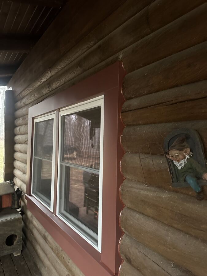 New large picture window on the same stone-clad wall after replacement