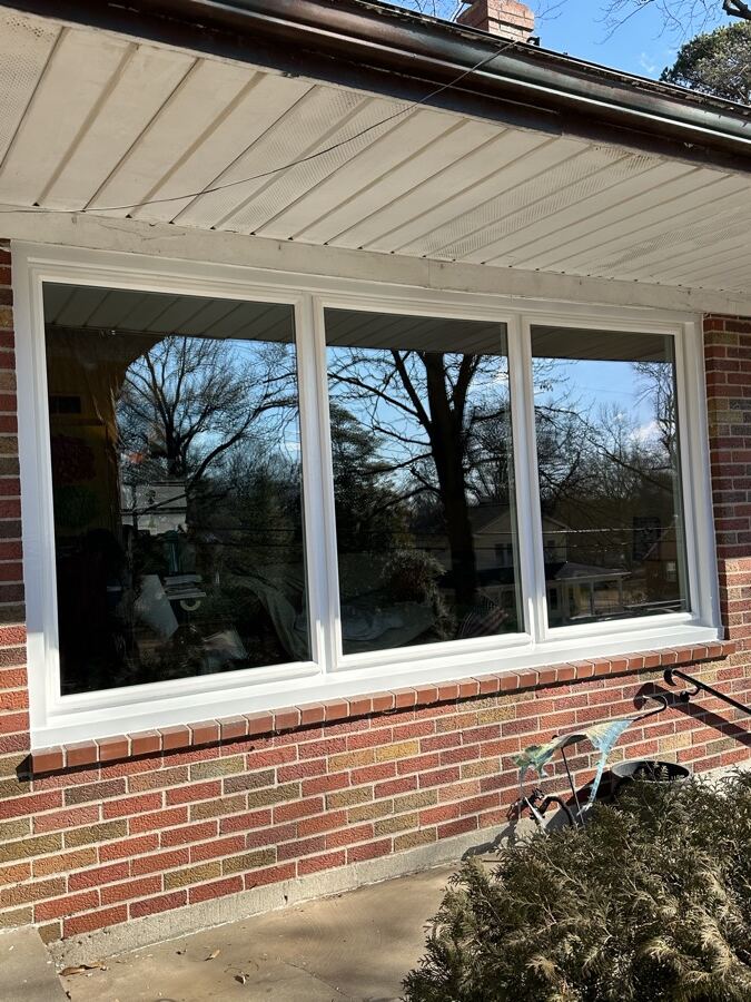 Three picture units replacing a worn wood frame on a brick elevation