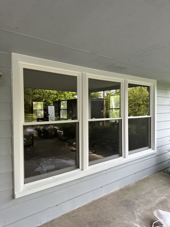 New white triple window on the same porch after replacement